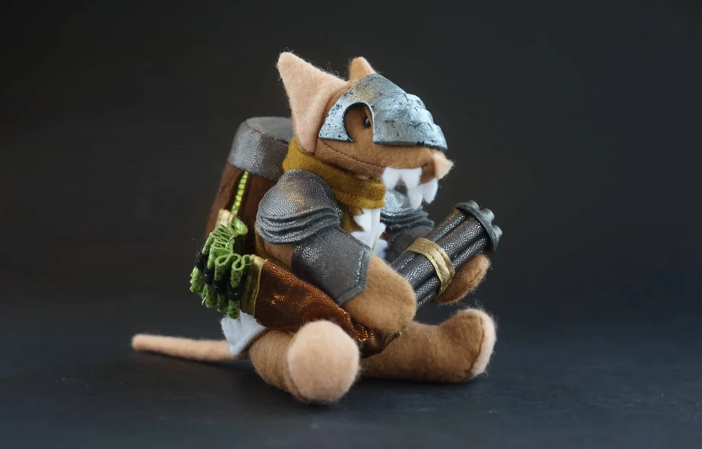 The Jongleurs Dream presents a Ratling Gunner plush collectible - A cuddly version of the Skaven warrior, standing with a Ratling Gun, ready to unleash a barrage of warpstone bullets. This premium soft toy is perfect for fans of tactical games and collectors of plush figures inspired by heroic quests and legendary sagas.