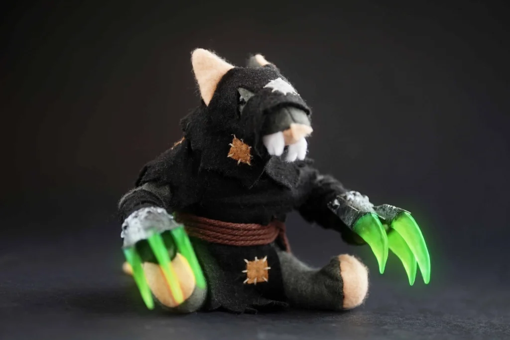 The Jongleurs Dream presents a Gutter Runner plush collectible - A cuddly version of the stealthy and agile Skaven assassin, lurking in the shadows of the fantasy realm, ready to strike with its poisoned blades. This premium soft toy is perfect for fans of immersive worlds and collectors of plush figures inspired by the epic grimdark fantasy realm and legendary sagas.