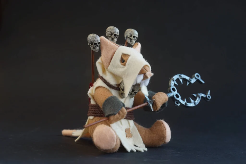 The Jongleurs Dream presents a Hook Rat plush collectible - A cuddly version of the cunning and mischievous creature lurking in the shadows of the grimdark fantasy realm. This premium soft toy is perfect for fans of miniature tabletop gaming and collectors of detailed plush figures inspired by epic battles and legendary sagas.