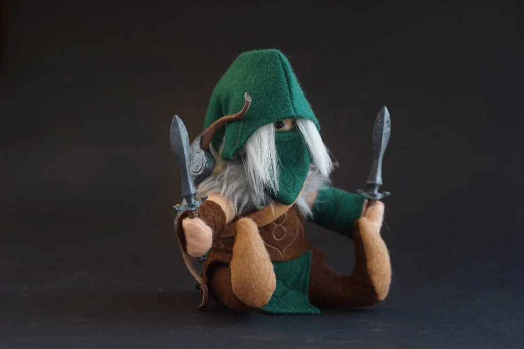 The Jongleurs Dream presents Kerrilian, the enigmatic and skilled elf from a grimdark fantasy world, now reimagined as a premium plushie collectible. This detailed desk display piece captures her iconic grace and fierce determination in soft fabric form, perfect for fans of epic tabletop battles and collectors of fantasy-inspired plush figures.