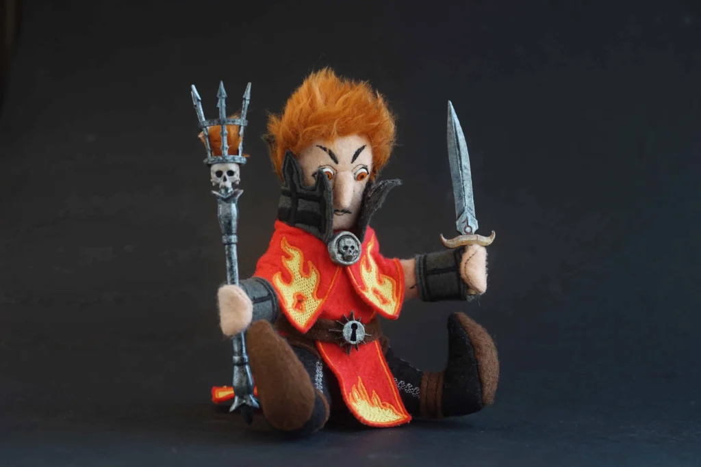 The Jongleurs Dream presents Sienna Fuegonasus, the fiery and unpredictable battle wizard, now reimagined as a premium plushie collectible. This detailed desk display piece captures her blazing personality and iconic robes in soft fabric form, perfect for fans of epic storytelling and collectors of fantasy-inspired plush figures.